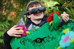 Child wearing eSight at Legoland